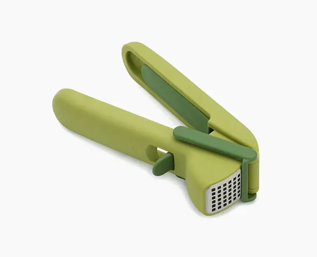 joseph-joseph-cleanforce-green-garlic-press-with-wiper-blade-and-cleaning-tool image 1