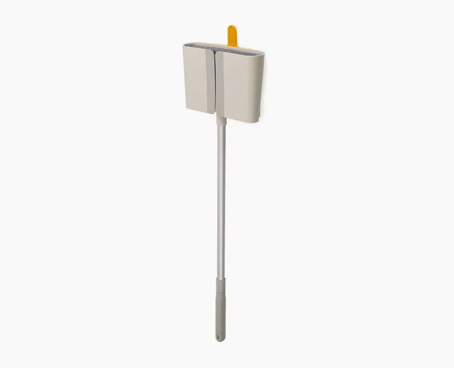 joseph-joseph-cleantech-wall-mounted-broom-with-telescopic-handle-and-dust-shiel image 1