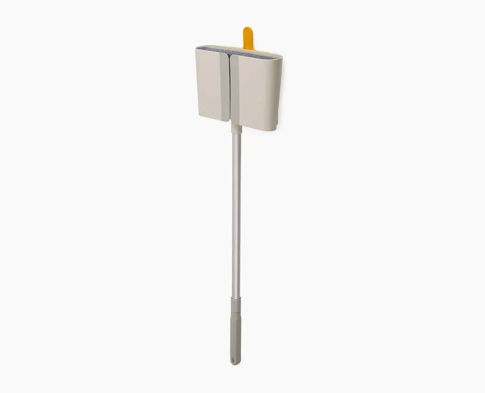 joseph-joseph-cleantech-wall-mounted-broom-with-telescopic-handle-and-dust-shiel image 1
