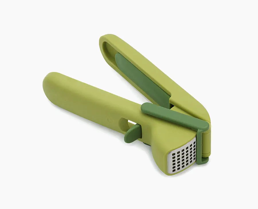 joseph-joseph-cleanforce-green-garlic-press-with-wiper-blade-and-cleaning-tool image 1