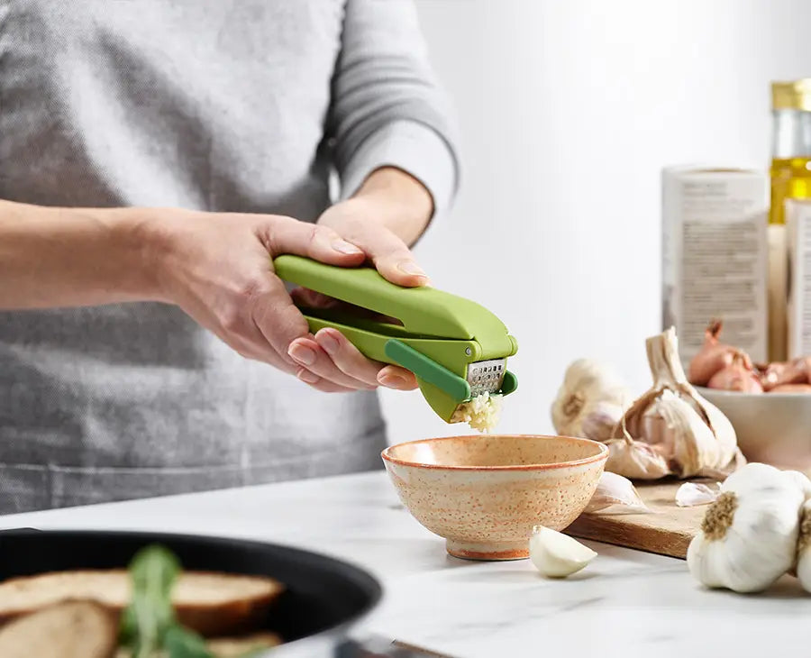 joseph-joseph-cleanforce-green-garlic-press-with-wiper-blade-and-cleaning-tool image 2