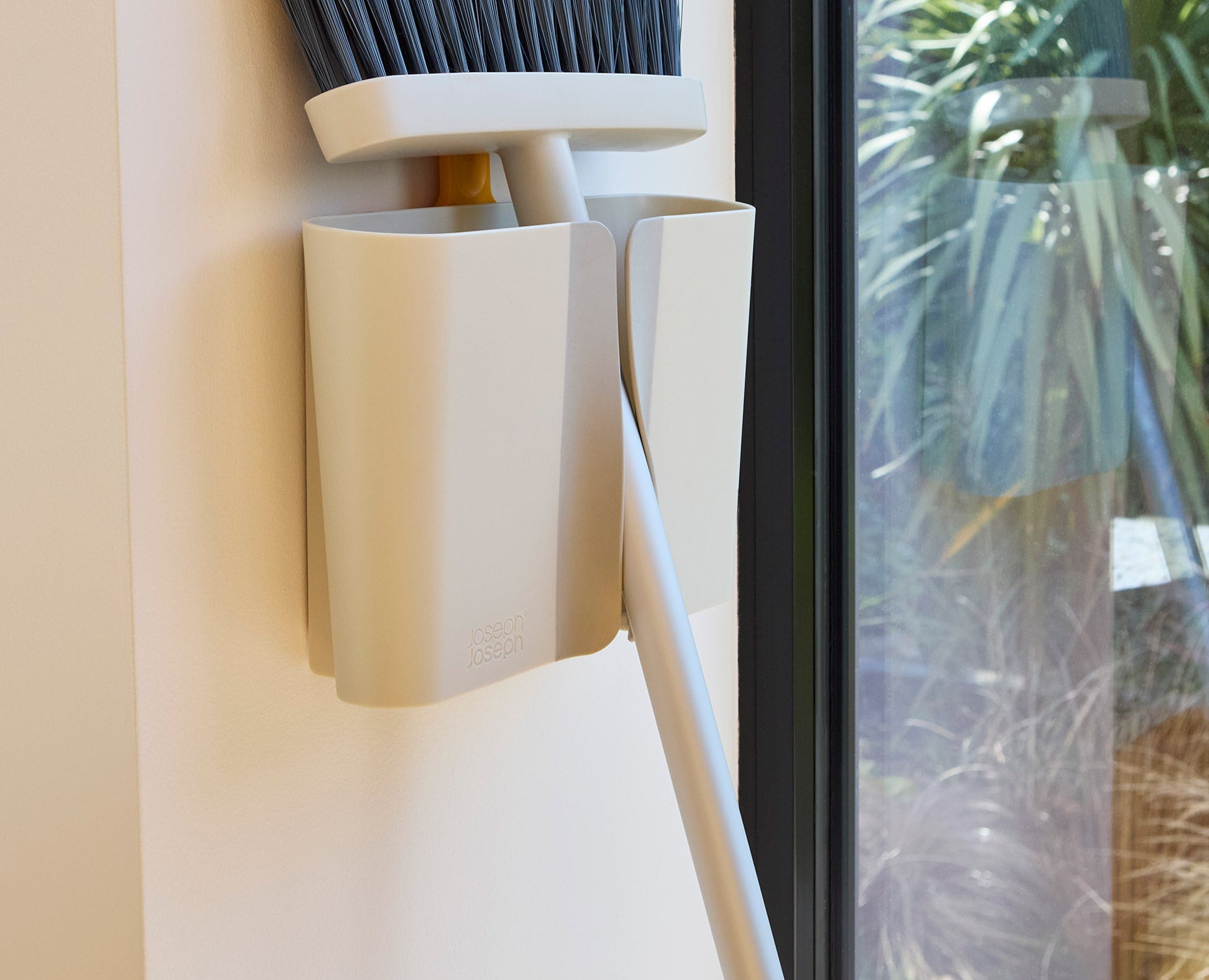 joseph-joseph-cleantech-wall-mounted-broom-with-telescopic-handle-and-dust-shiel image 4